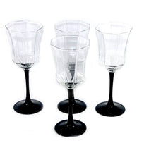 Load image into Gallery viewer, Vintage set of four 1980s octagonal tall wine glasses with black stems
